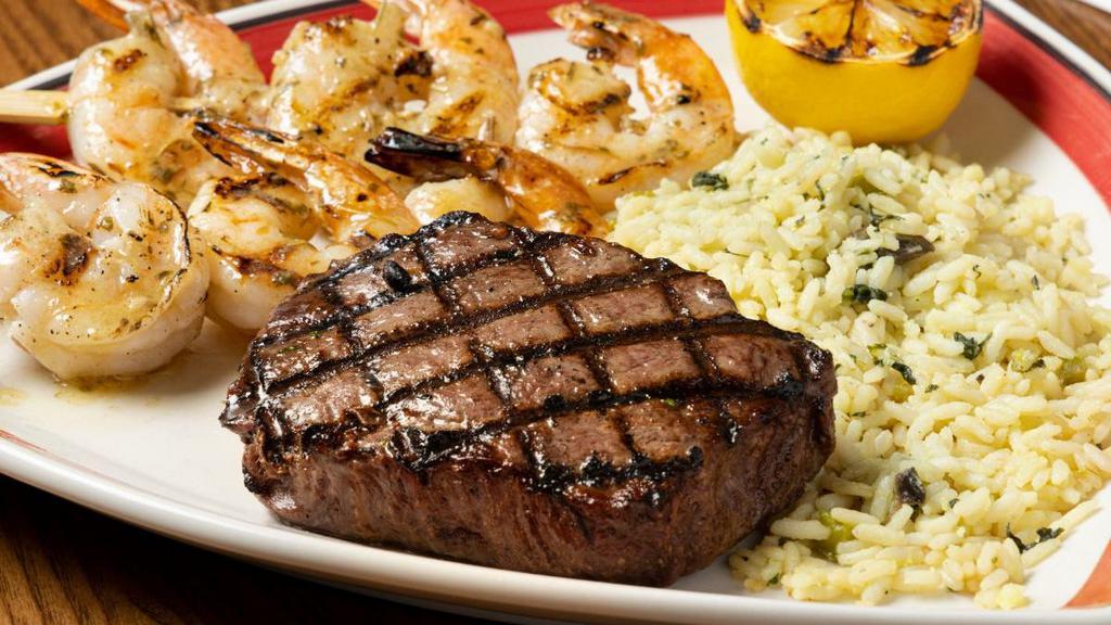 Sirloin* & Grilled Shrimp Skewers Combo · A tender and juicy 8 oz. Top Sirloin flame broiled to your taste paired with delicious shrimp seasoned and grilled to perfection. Served with one side.
