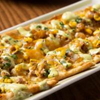 Carnitas Flatbread · Crisp flatbread glazed with queso and topped with slow-roasted carnitas, fire roasted corn, ...