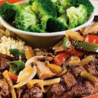 Smothered Tips* · Our signature Broiled Sirloin Tips smothered with fresh sautéed onions, peppers and mushroom...