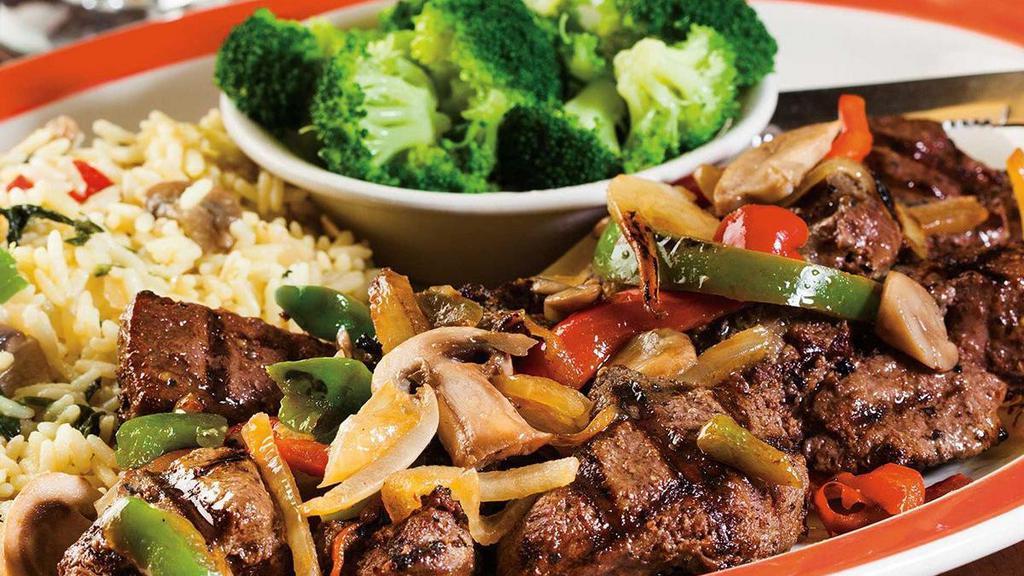 Smothered Tips* · Our signature Broiled Sirloin Tips smothered with fresh sautéed onions, peppers and mushrooms. Served with two sides.