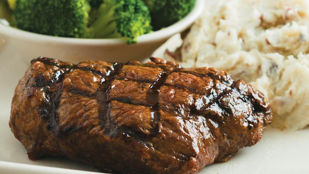 Top Sirloin Steak* · Tender and juicy. An 8 oz. top sirloin, cooked to your taste and dripping with flavor. Served with two sides.