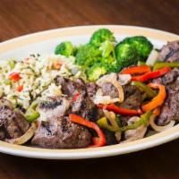 King Size Smothered Tips* · Our signature Broiled Sirloin Tips smothered with fresh sautéed onions, peppers and mushroom...