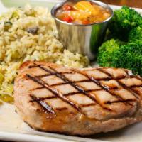 Pork Ribeye Steak · A boneless 10 oz. pork ribeye steak flame broiled to perfection. Served with two sides and t...