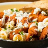 Buffalo Chicken Mac & Cheese · Skillet baked creamy cavatappi Mac & Cheese topped with crispy hand-breaded chicken tossed i...