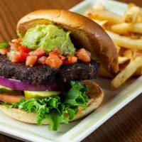 Southwest Black Bean Burger · Chipotle-spiced and topped with fresh pico de gallo and guacamole. Stacked on a brioche bun ...