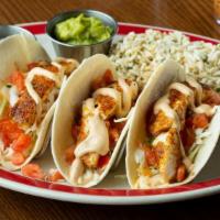 Baked Fish Tacos · Warm flour tortillas filled with baked Southwest seasoned fish filet, fresh cabbage, fresh p...