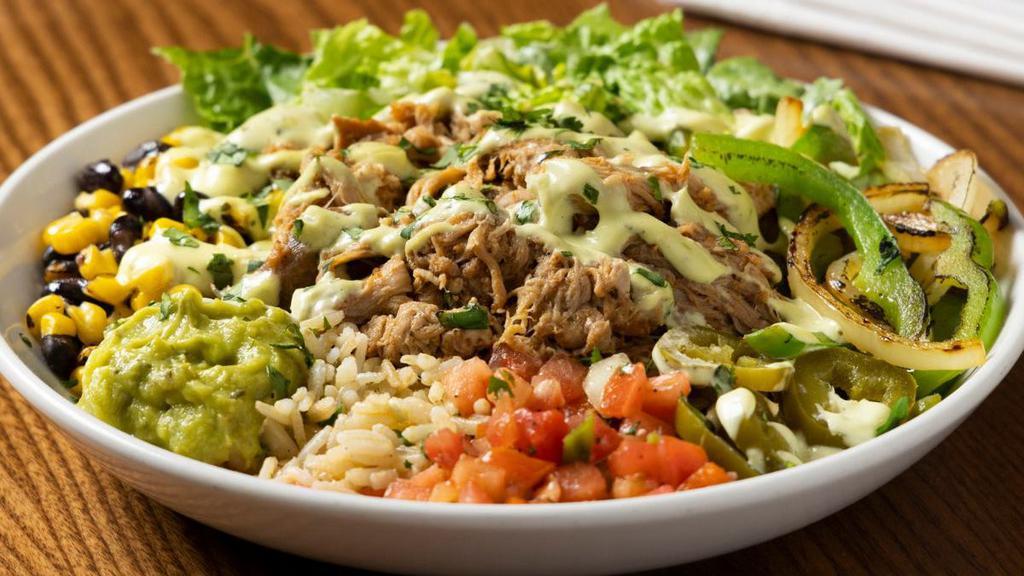 Southwest Fajita Carnitas Bowl · South of the border style with sautéed onions and peppers, crisp romaine, corn, black beans, fresh pico de gallo, guacamole, jalapeños and steamed brown rice. Topped with fresh cilantro, chipotle sauce and slow-roasted carnitas.