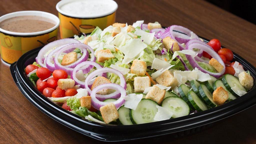 House Salad · Tomatoes, cucumbers, red onions, parmesan cheese and croutons. Choose your dressing.