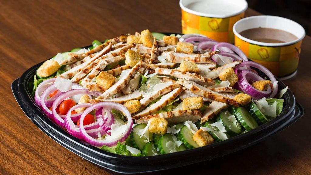 House Salad With Grilled Chicken · House Salad with tomatoes, cucumbers, red onions,  parmesan cheese and croutons, topped with hbroiled, chilled, sliced chicken.  Choose your dressing.