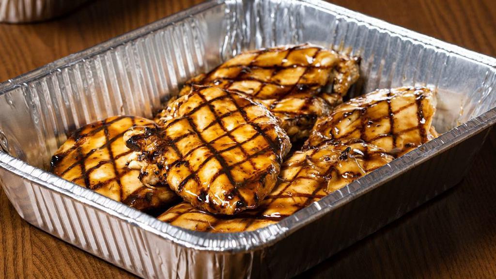 Grilled Balsamic Chicken · Tender lemon rosemary marinated chicken breasts flame broiled with a balsamic glaze.