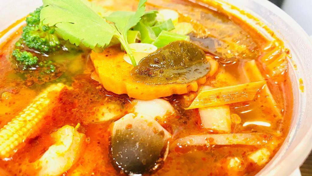 Tom Yum Soup · Savoury, spicy and sour soup with lemongrass, kaffir lime, mushroom, baby corn, onion and tomato.