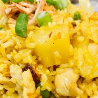 Pineapple Fried Rice · Flavorful fried rice with pineapple, cashew nuts, onion, tomato, scallion, raisins, peas, ca...