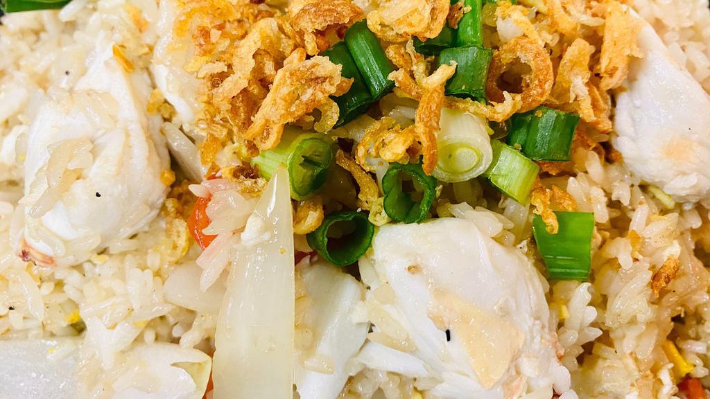 Crab Fried Rice · The king of Thai fried rice. Real lump crabmeat, garlic, onion, scallion, and egg.