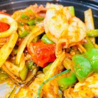 Seafood Pad Cha · Sautéed seafood, wild ginger, fresh peppercorn, onion, bell pepper, basil and string bean wi...