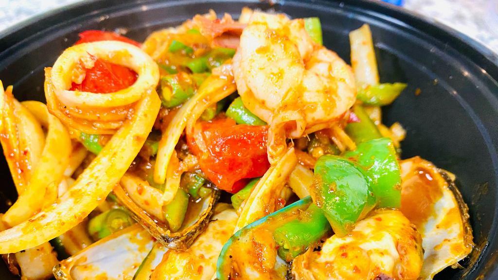 Seafood Pad Cha · Sautéed seafood, wild ginger, fresh peppercorn, onion, bell pepper, basil and string bean with spicy chili paste.
(available in medium, spicy, and thai spicy only)