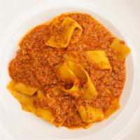 Pappardelle Bolognese · Homemade pasta in a meat sauce.