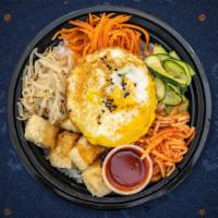 Bibimbap Bliss Bowl · Korean-style coconut-rice bowl topped with seitan, avocado, green black seaweed, chick peas,...