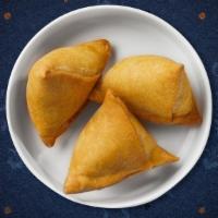 Curry Samosas · Home-made veg pastries with mint chutney dip.