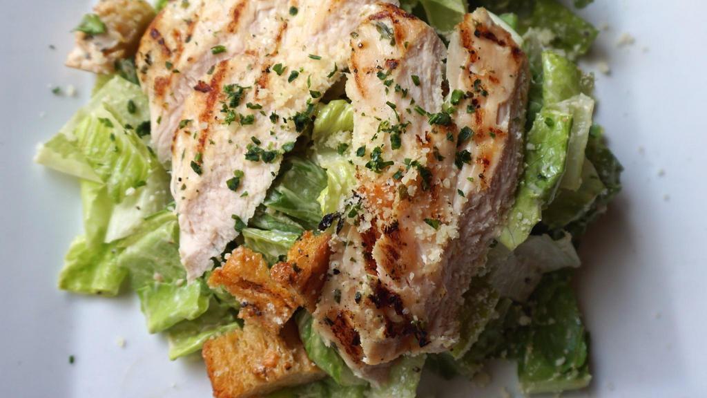 Grilled Chicken Caesar Salad · Grilled chicken, romaine, parmesan, croûtons, caesar dressing