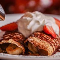 Nutella Crepes · With Amaretto strawberry and banana.
