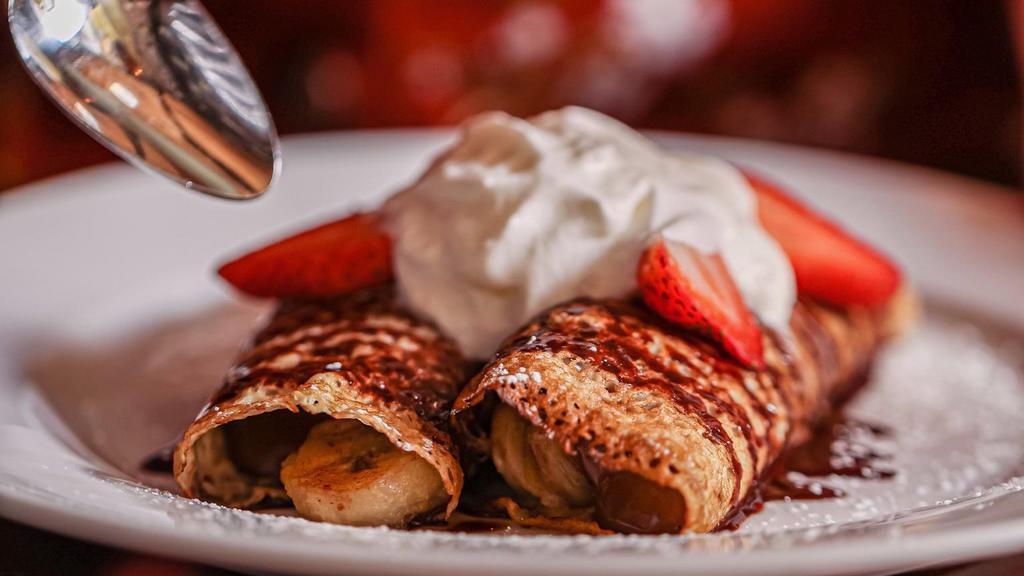 Nutella Crepes · With Amaretto strawberry and banana.