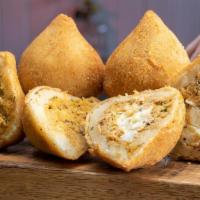 Traditional Coxinha · This is our take on the traditional-sized Coxinha. Deliciously filled with seasoned shredded...