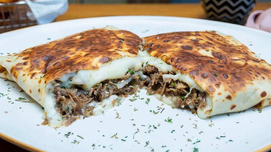 Shredded Beef Crêpe · Perfectly seasoned shredded beef with onions, and snack-mix cheese. Served with your choice of side.
