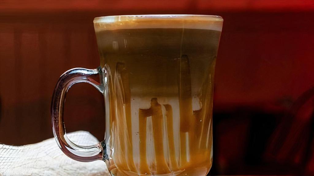 Caramel Latté · An espresso-based caramel infused coffee drink prepared with steamed milk foam, topped with whipped cream and caramel drizzle. Iced option available!