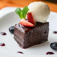 Chocolate Ganache · Gluten-free. berry reduction, vanilla ice cream.