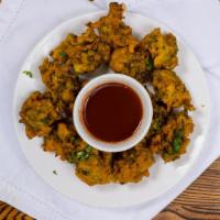 Vegetable Pakora · Florets of assorted vegetables deep-fried in a special chickpea butter.