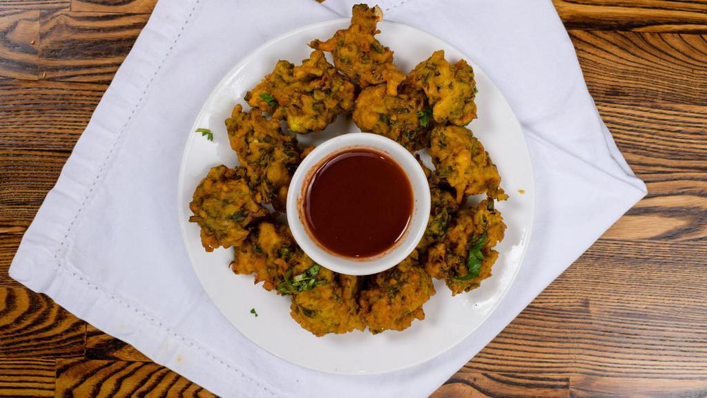 Vegetable Pakora · Florets of assorted vegetables deep-fried in a special chickpea butter.