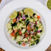 Cucumber Salad · Diced cucumbers, carrots, tamarind sauce with tangy spices.