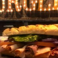 Grilled Pastrami Sandwich · Grilled Pastrami Sandwich Served on a baguette. Served with choice of  lettuce, tomato, onio...