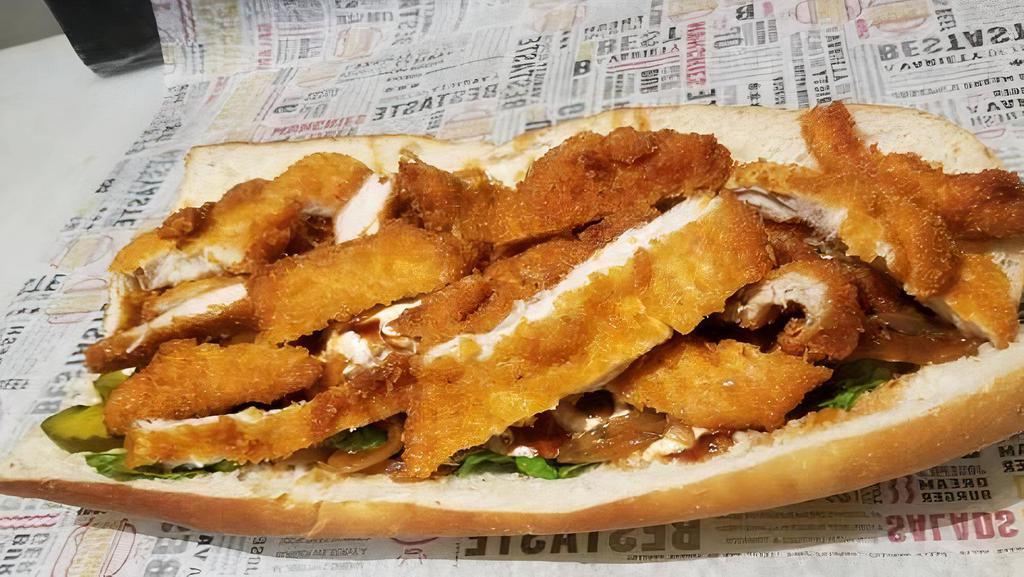 Crispy Chicken · Served on a baguette. Served with lettuce, tomato, onions, pickles, and your choice of sauce.