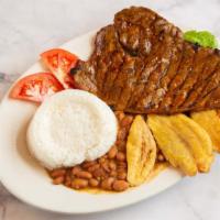 Grilled Beef Served With Rice, Beans & Green Plantains · Served with rice and french fries.