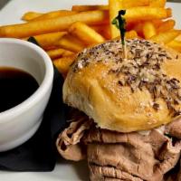 Beef On Weck · Our house dressed roast beef marinated in au ju served with horsey-mayo on a kimmelweck roll