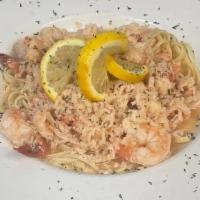 Crab, Lobster & Shrimp Scampi · Parmesan, garlic, herbs, lemon, white wine sauce & linguine