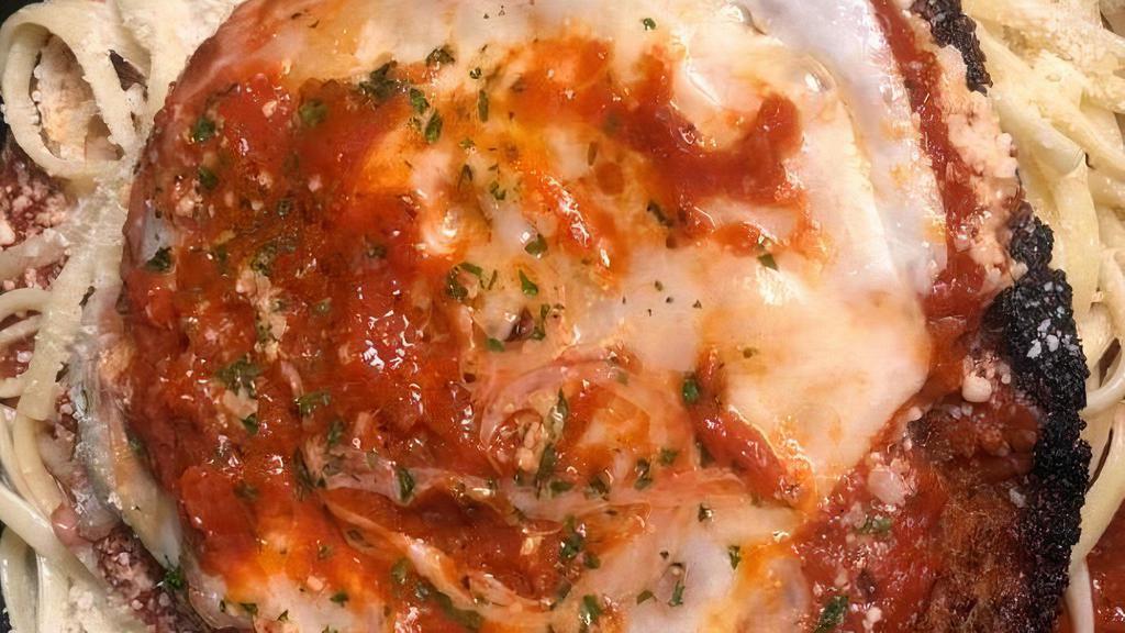 Chicken Parmesan Dinner · Chicken cutlet topped with mozzarella, parmesan, romano baked golden brown over linguine in our homemade marinara sauce