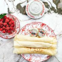Crêpes Au Mascarpone · Three hand rolled crepes served with rich mascarpone and your choice of fresh fruit or accom...