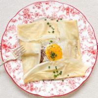 Crêpes Madame · Folded savory crepe filled with one fried egg, gruyere cheese, herbs de Provence, and your c...