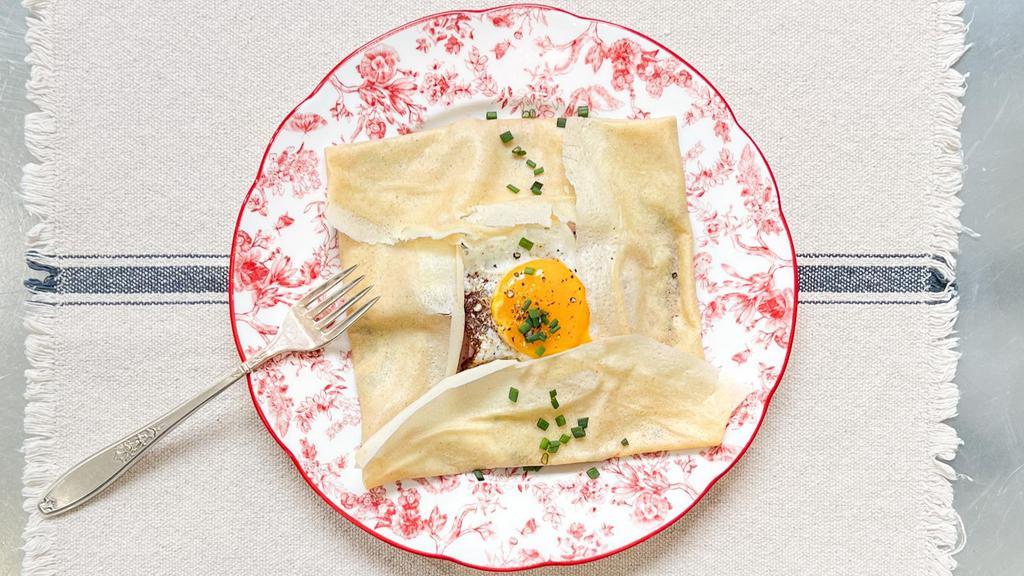 Crêpes Madame · Folded savory crepe filled with one fried egg, gruyere cheese, herbs de Provence, and your choice of additional fillings (optional).
