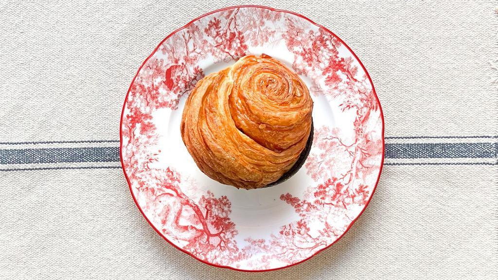 Rouleau Du Matin · Flaky spiral croissant dough covered with cinnamon and brown sugar — Baked fresh each morning.