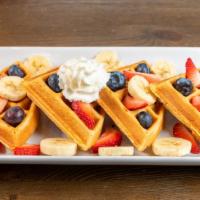 Belgium Waffles · Served with fruit strawberry and or banana and or blueberry.