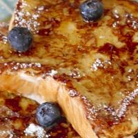 Homemade French Toast · Served with maple syrup.