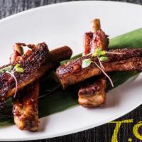 Grilled Baby Spare Ribs (4Pcs) · Slow-cooked, fall-off-the-bone baby spare ribs ,brushed with asain  BBQ Sauce