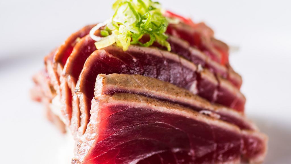 Tuna Tataki · Pan seared tuna with tobiko, scallion, and cucumber in a ponzu dipping sauce