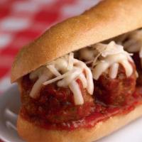 Meatball Parmesan Sandwich · Homemade meatballs, homemade tomato sauce, mozzarella and seeded wedge bread.