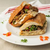 The Big Meats Sandwich · Grilled chicken, sausage, broccoli rabe, hot cherry peppers and fresh mozzarella on garlic b...