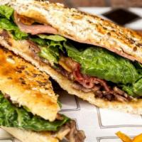 Russian Panini · Juicy roast beef, muenster cheese, caramelized onions, lettuce, tomatoes, and russian dressi...