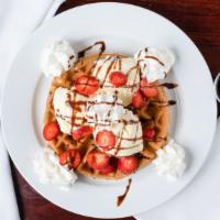 D&D'S Belgian Waffle · Served with 2 scoops of vanilla ice cream, strawberries, whipped cream and chocolate syrup.